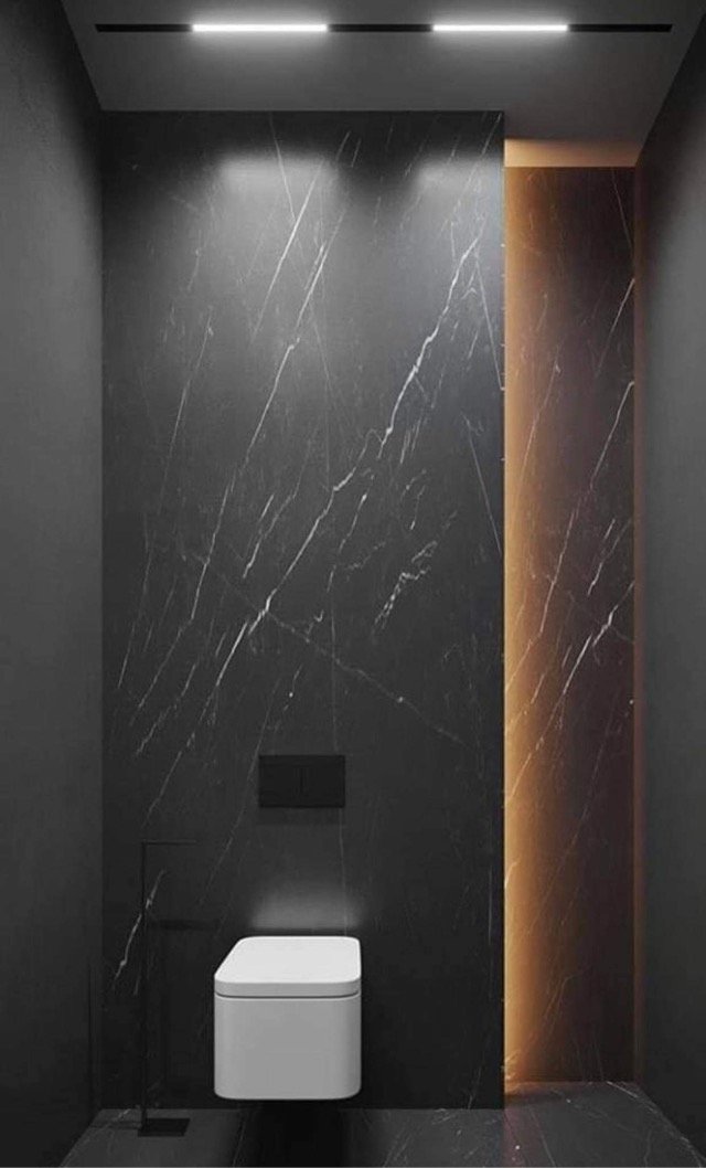 Full-height marble-look bathroom feature wall